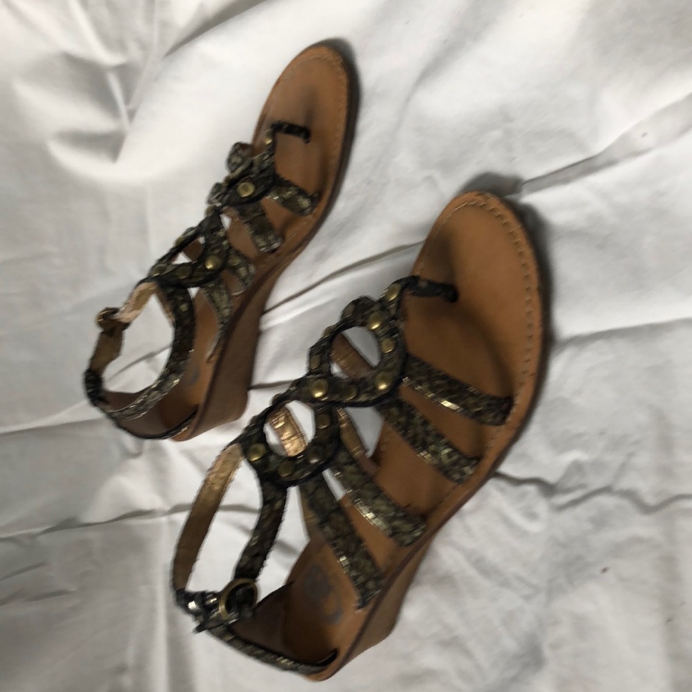 Gold and black leather sandal with metal studs